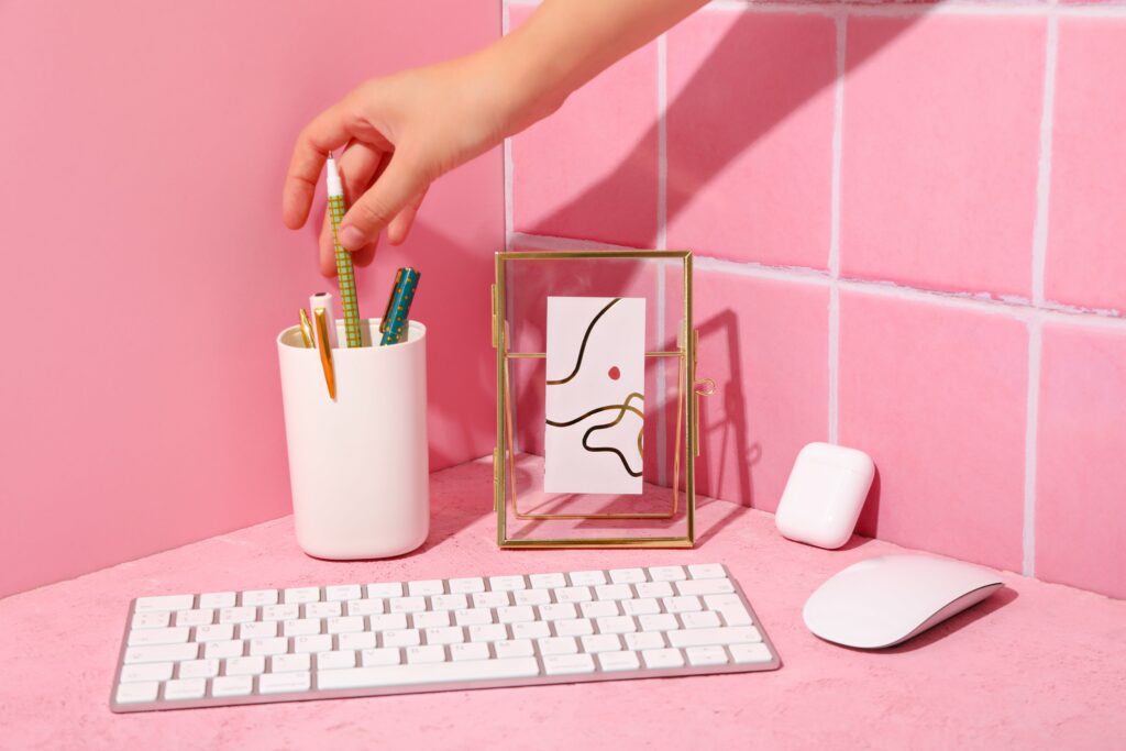 computer-keyboard-with-mouse-cassette-pink-background-min